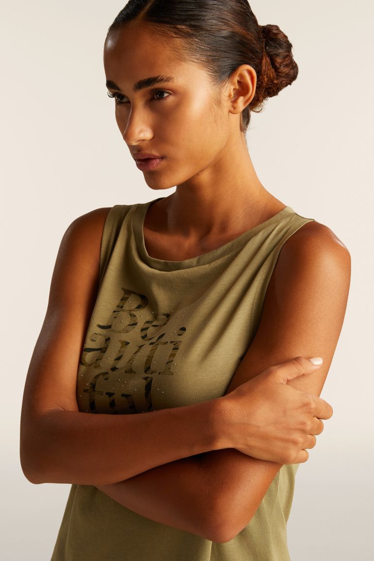 Carica immagine in Galleria Viewer, Canotta con fondo svasato e grafica con borchie