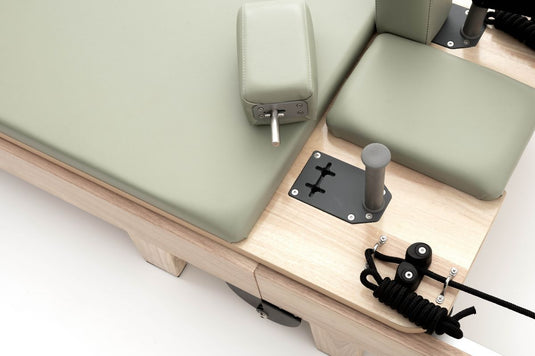 Lettino Reformer Pilates Salvaspazio in Legno Mooma
