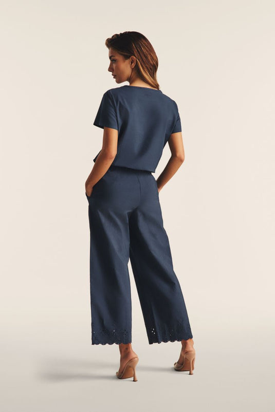 Pantaloni wide leg in cotone navetta con ricami Sangallo