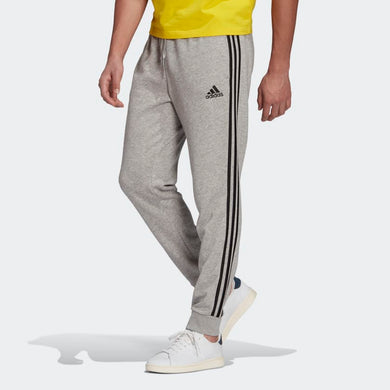 PANTALONI ESSENTIALS FRENCH TERRY TAPERED CUFF 3-STRIPES